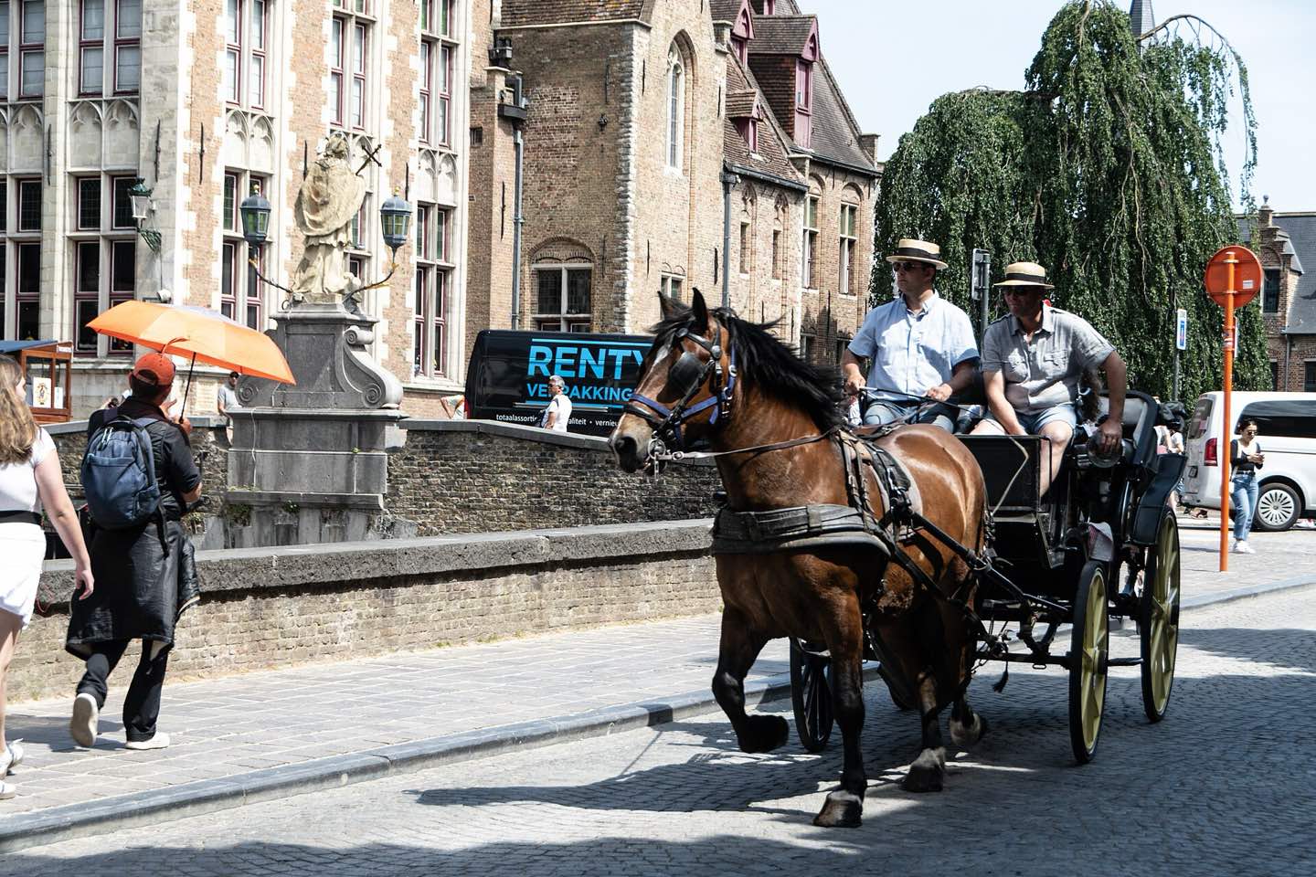 A horse-drawn carriage on the Rozenhoedkaai in Bruges
