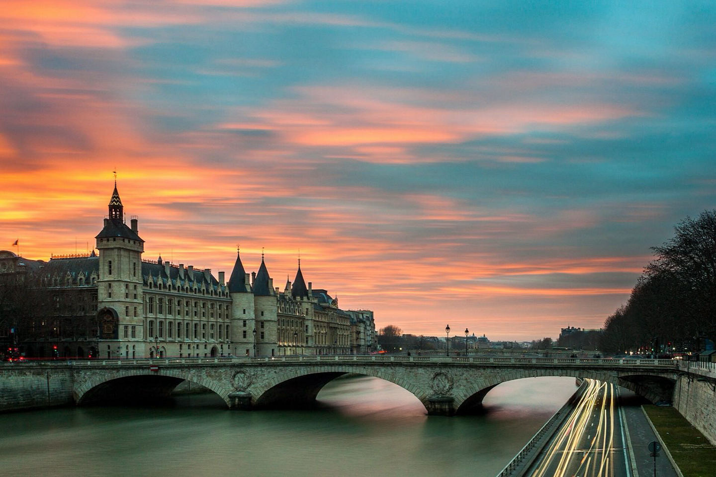 Sunset over the Seine with a bridge in silhouette