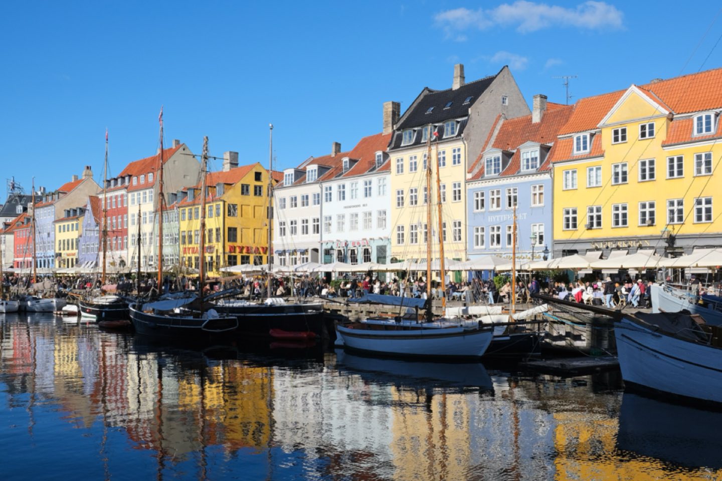 Painted townhouses and wooden sailing boats along the Nyhavn canal