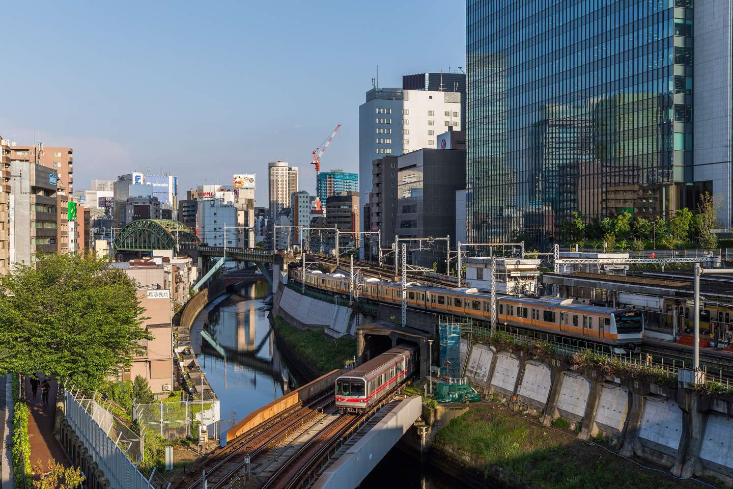JR and Tokyo Metro trains crossing at Ochanomizu above the Kanda River