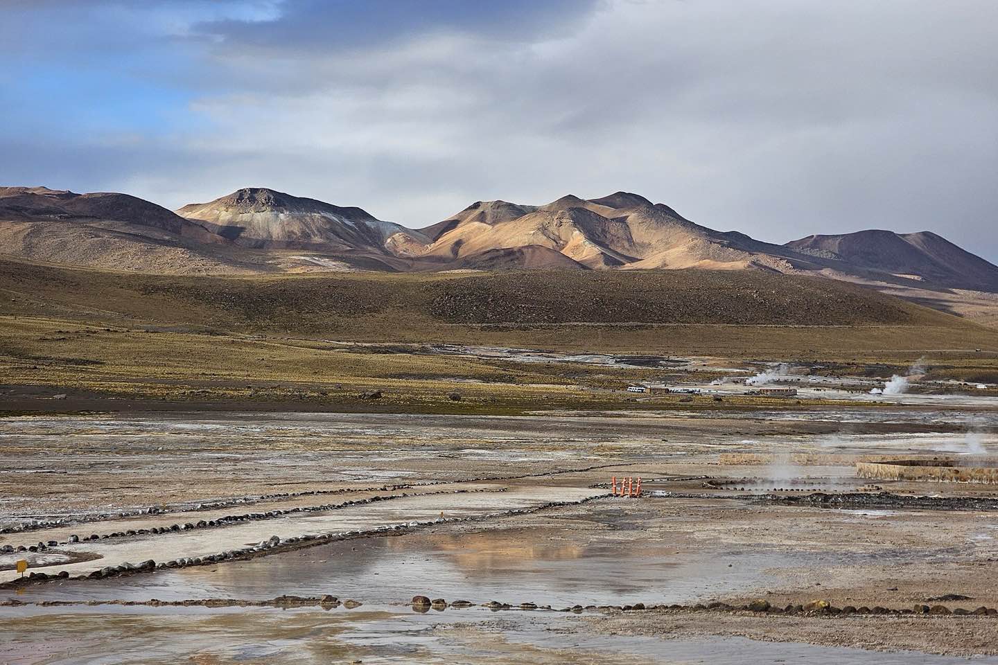 Steam rising from the El Tatio geyser field at dawn