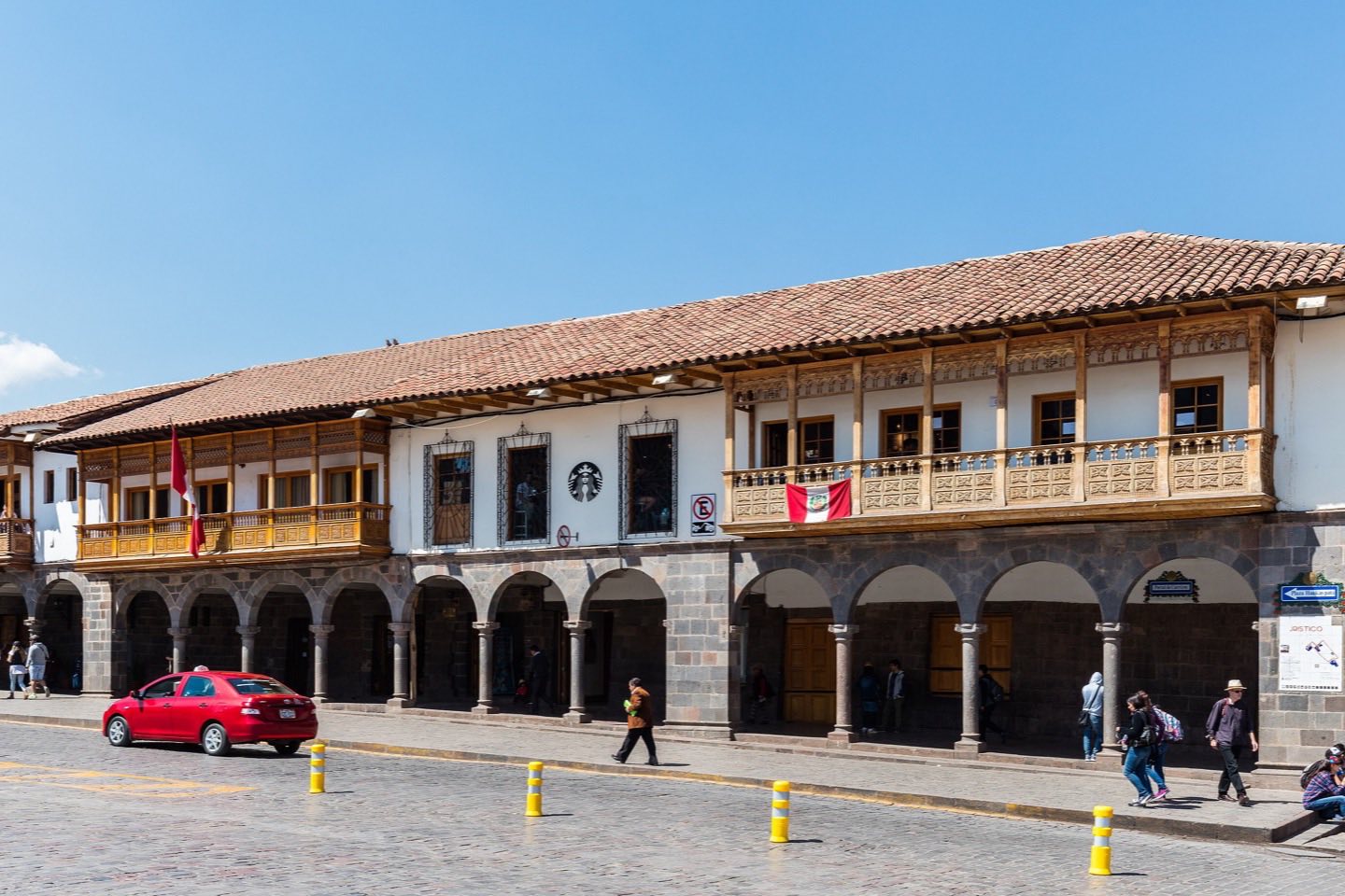 Cusco cathedral and Plaza de Armas under a blue sky