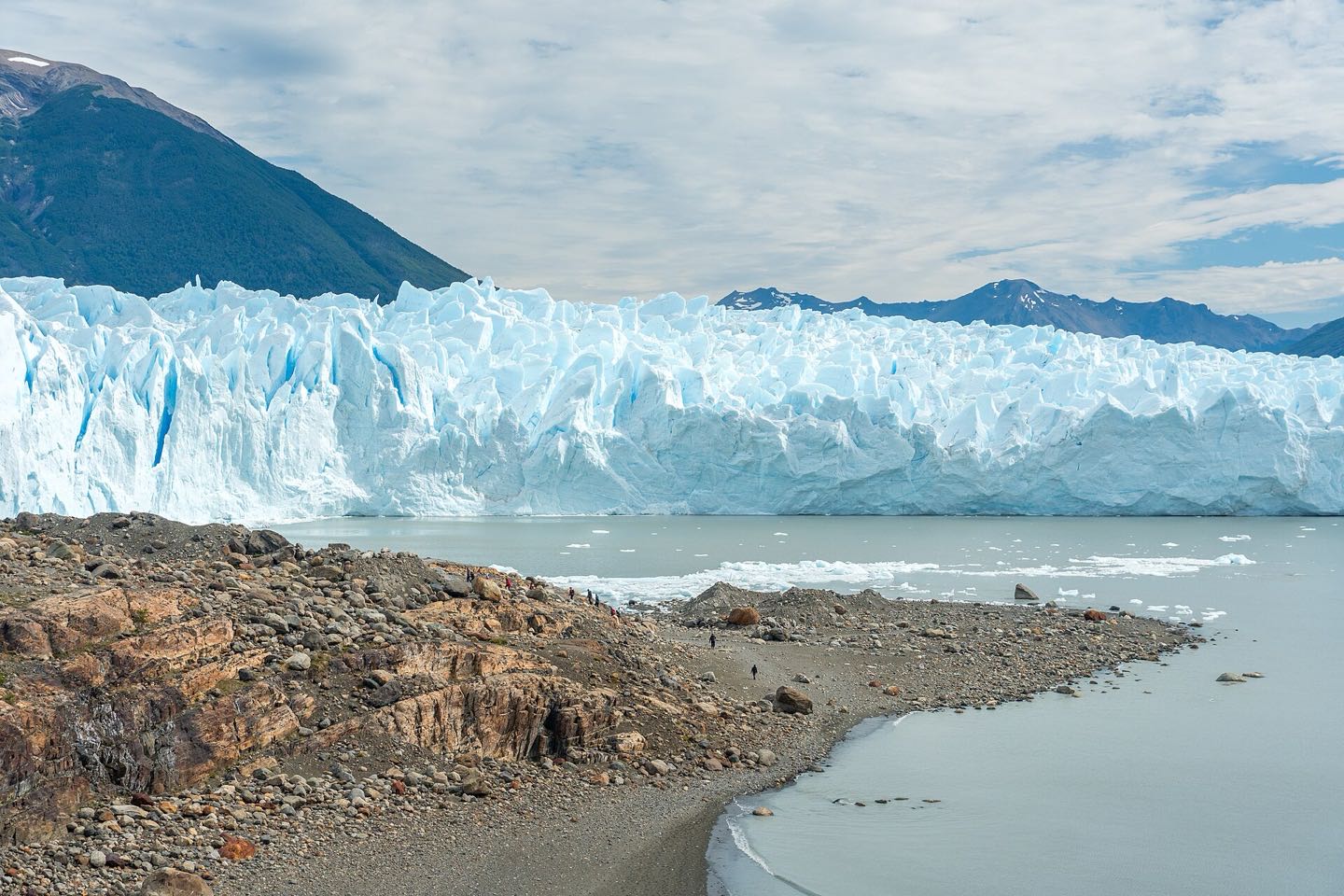 Roped trekkers in crampons on the Perito Moreno glacier