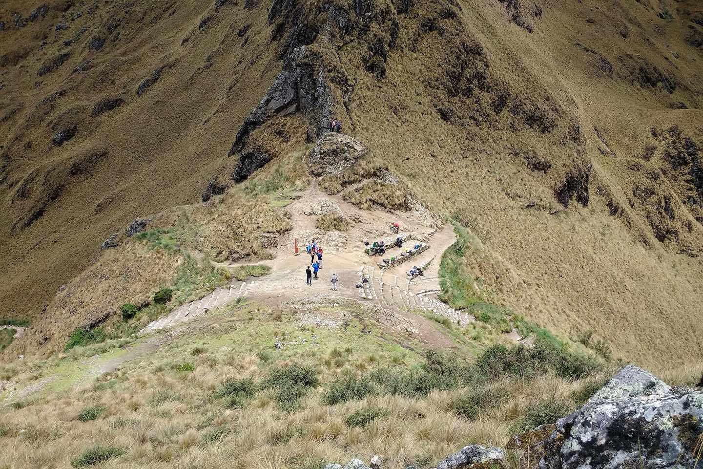 Trekkers resting at the top of Dead Woman's Pass on the Inca Trail