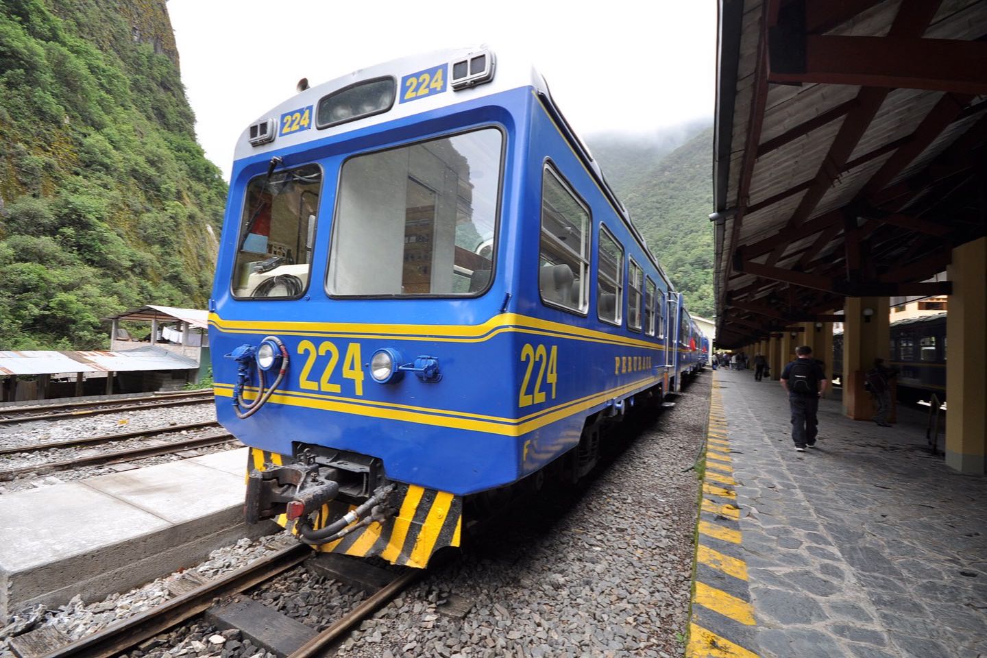 A blue Vistadome car at the Aguas Calientes station