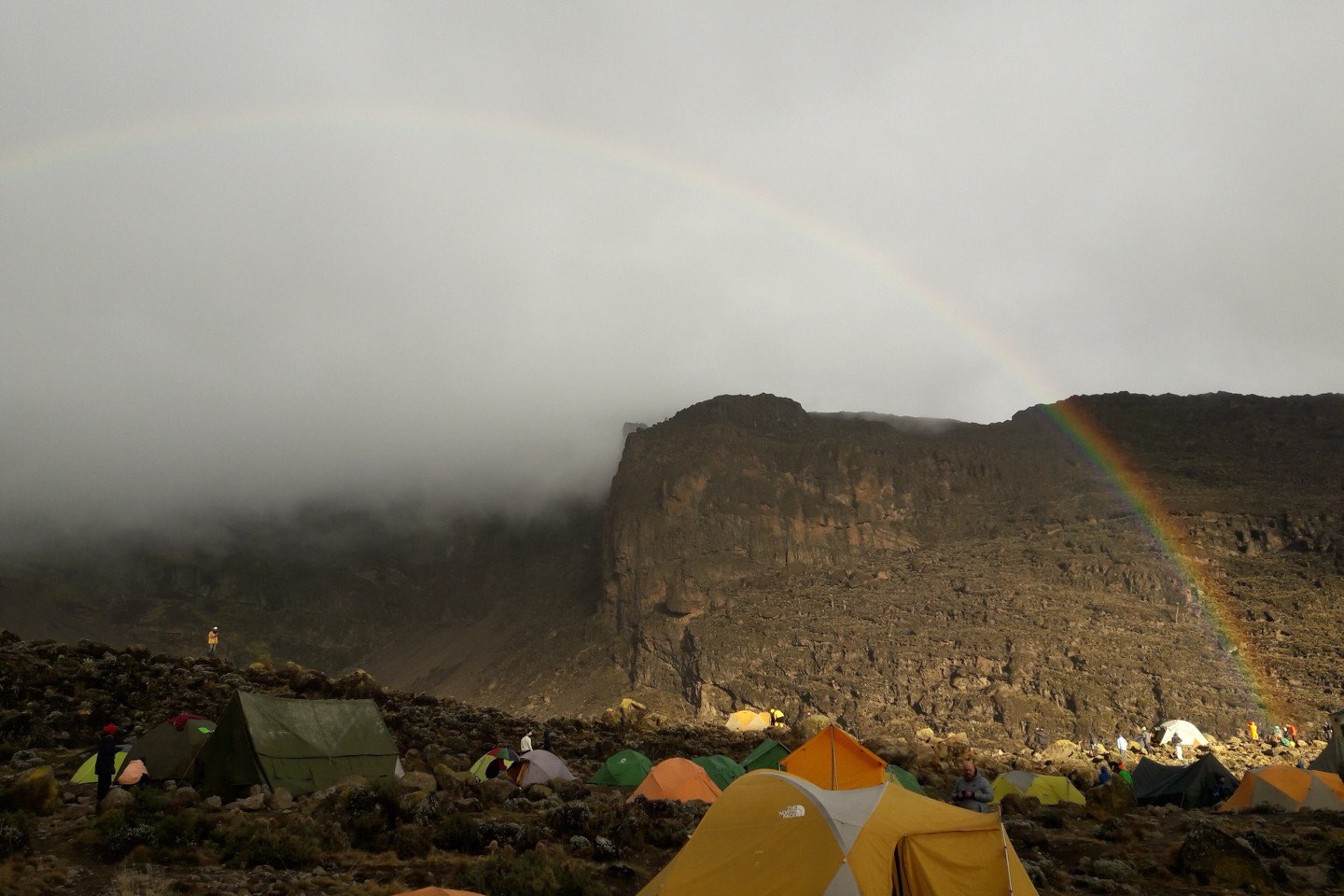 Tents at Barranco camp below the Barranco Wall on Kilimanjaro, with a rainbow in the mist